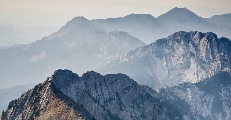 Layered misty mountain ridges