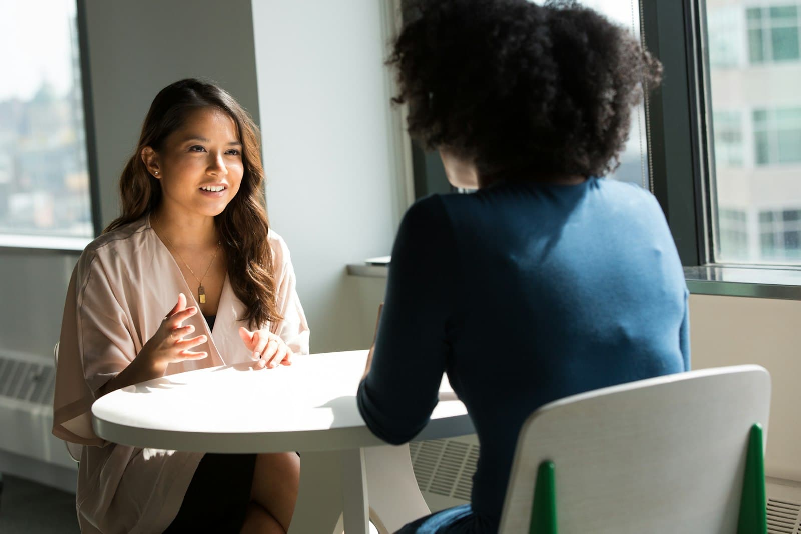 Two women in a one-on-one coaching conversation